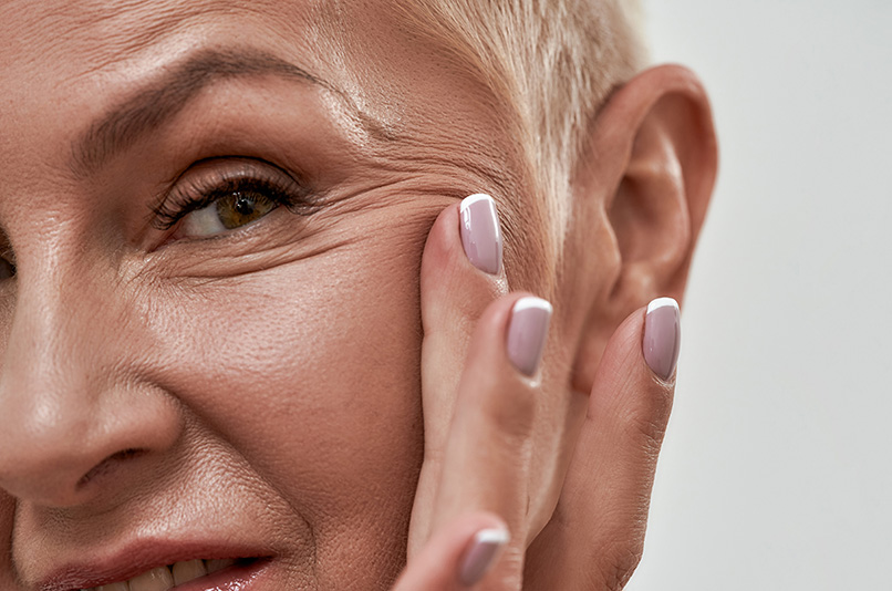 Cute wrinkles around eyes on middle aged woman